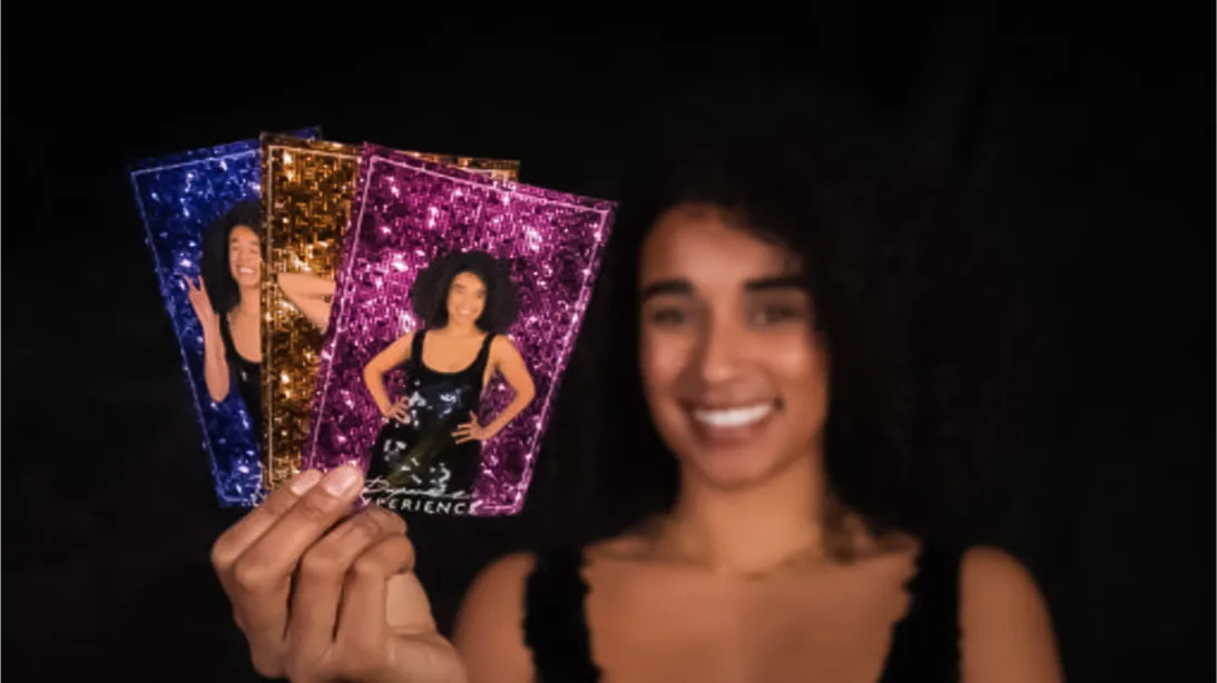 Paparazzi Photo and Video Experience. a woman holding her high quality photo booth prints. Paparazzi Photo Booth