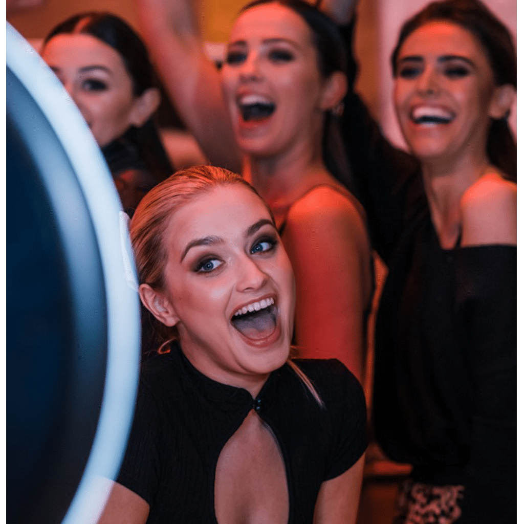 Group of friends posing at a Selfie Station photo booth rental in New England