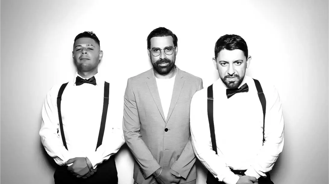 drop off booth rentals in NE and area. A groupd of people posing for a photo booth with a corporate party drop off photo booth rental