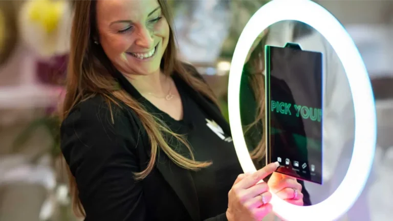 new england photo booth rental. a photo booth attendant using a photo booth at a corporate event