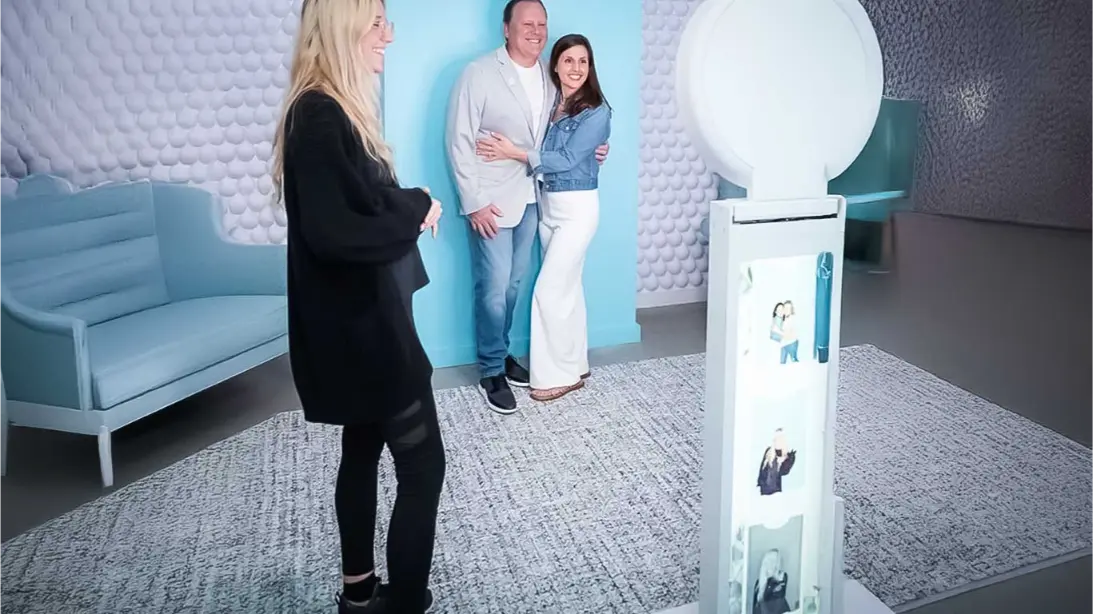 drop off booth rentals in NE and area. A groupd of people posing for a photo booth with a corporate party drop off photo booth rental