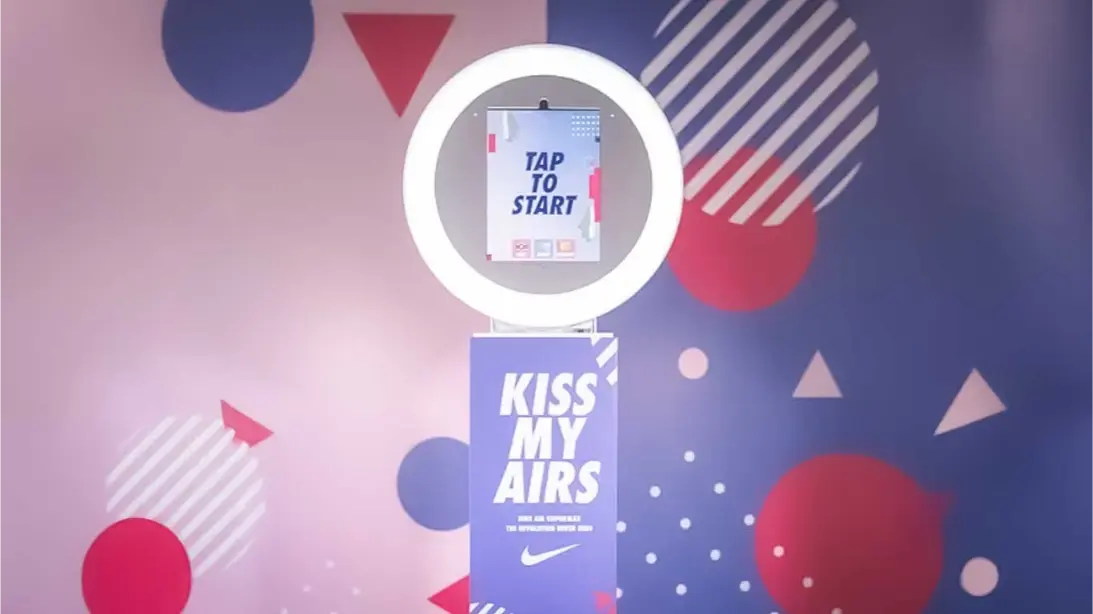 Branded Tap to Start photo booth screen with custom overlay for Maine permanent installations