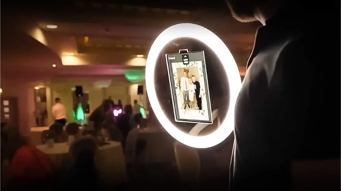 Roaming Photo Booth rental in NE. A photo of a hand held Roaming Photo Booth at a corporate and wedding event