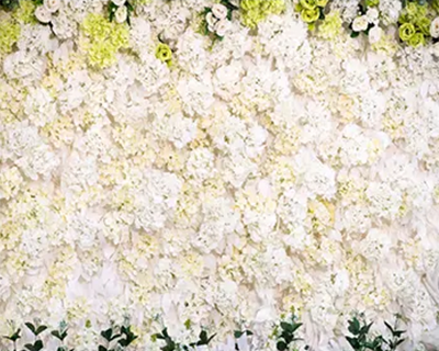 Custom flower wall backdrop with bride and groom using Magic Mirror of New England