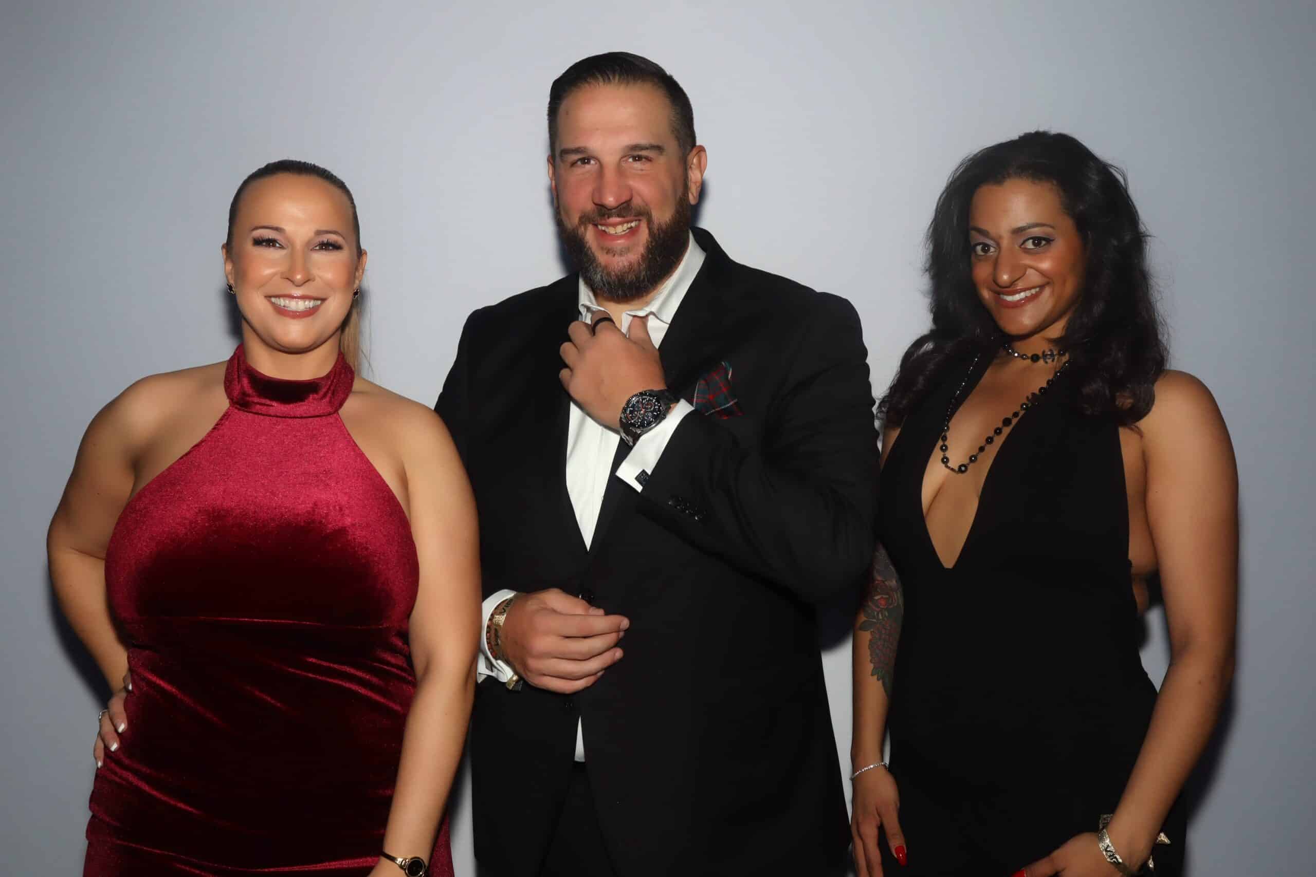 Runway Ball Boston Guests posing for luxury GLAM photo booth portraits at a formal event with studio lighting