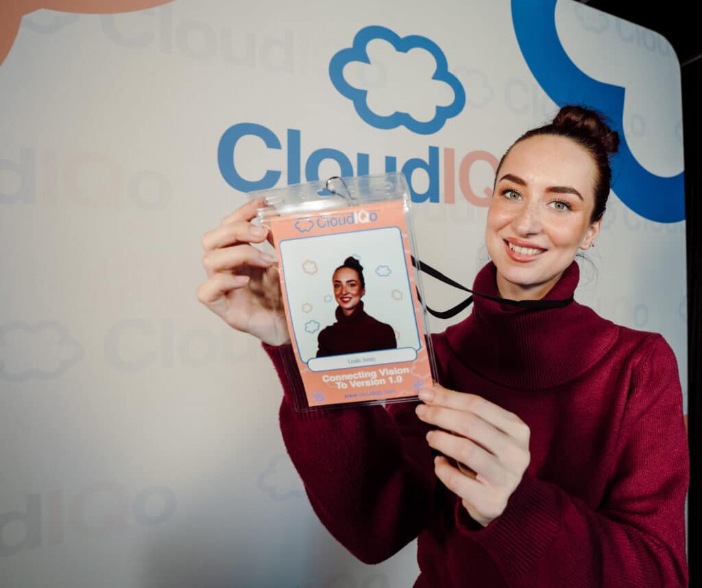 Attendees using an interactive photo booth experience at a corporate conference and trade show