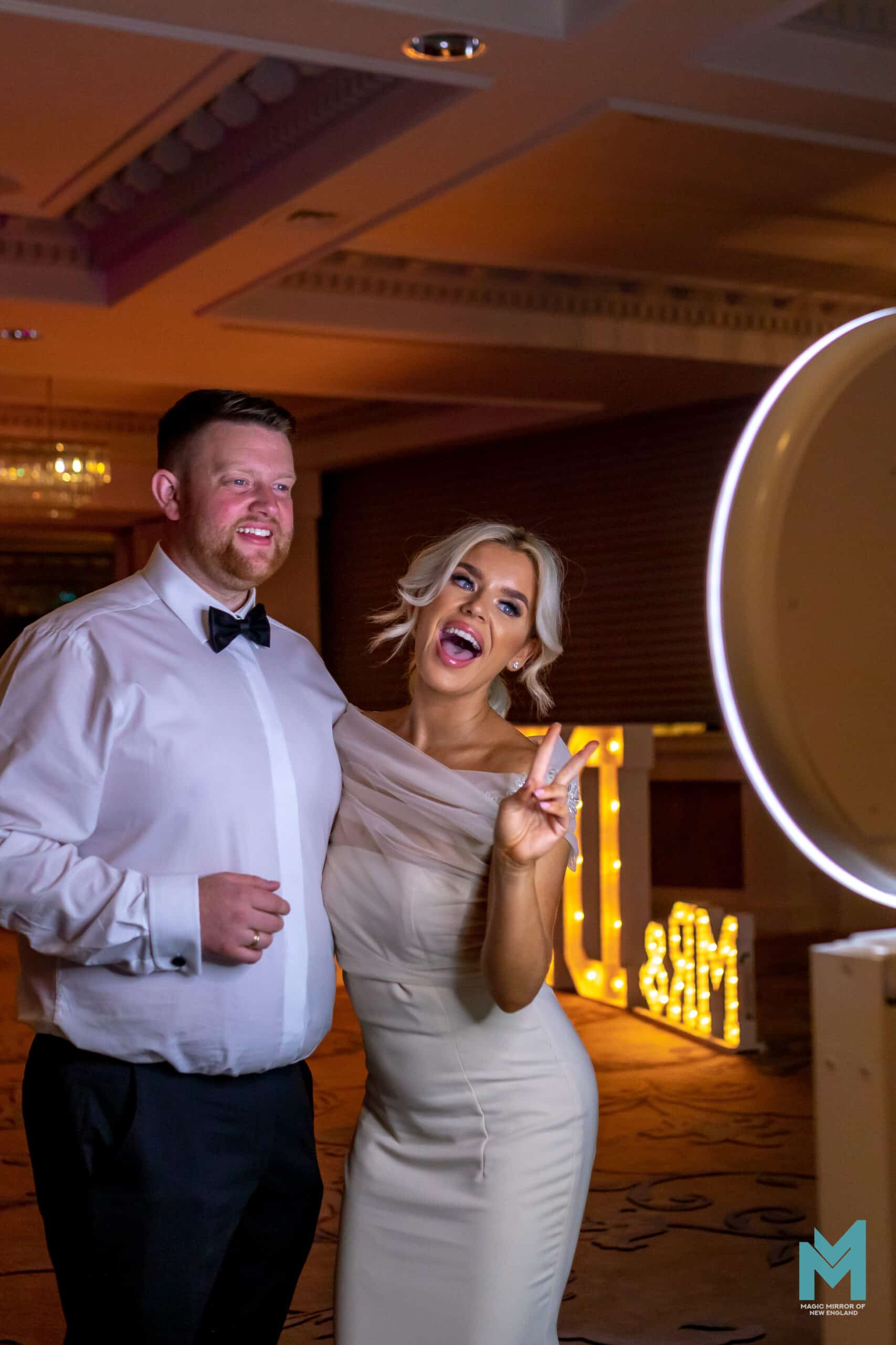 Wedding Selfie Station Digital Drop Off Booth Bride and groom using a modern wedding photo booth at a New England wedding reception