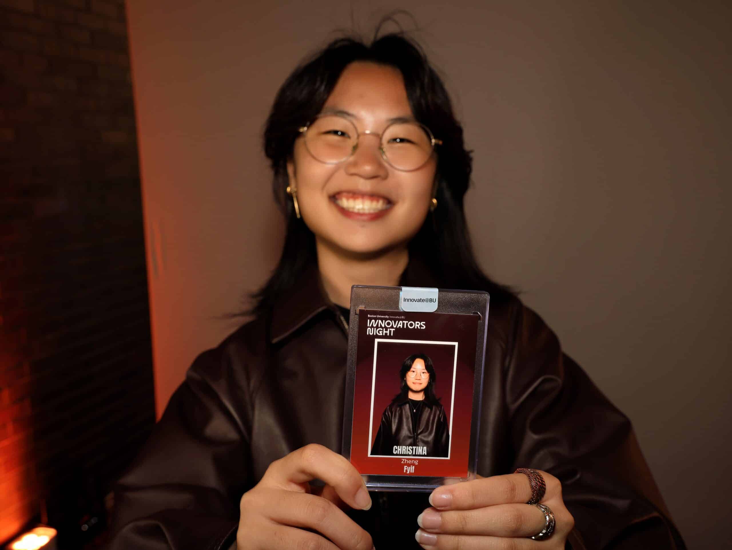 Guest holding a personalized trading card created at Magic Mirror of New England's interactive Trading Card Experience.