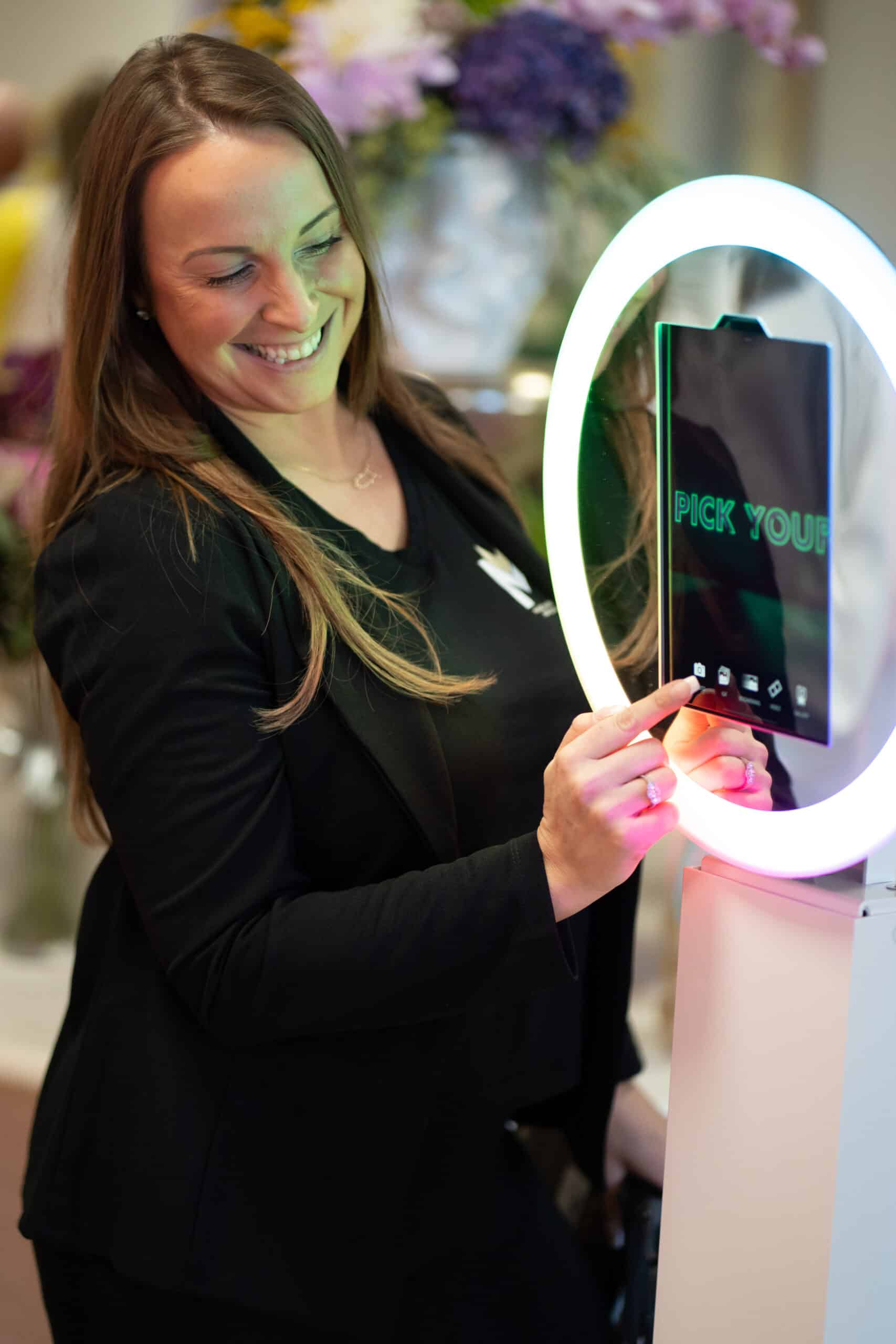 Guest using the Selfie Station Digital Drop-Off photo booth with instant photo, GIF, Boomerang, and video sharing at a corporate event.