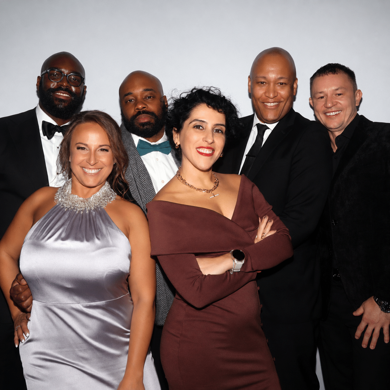 Group photo booth prints of smiling guests at a New Hampshire or Massachusetts event.