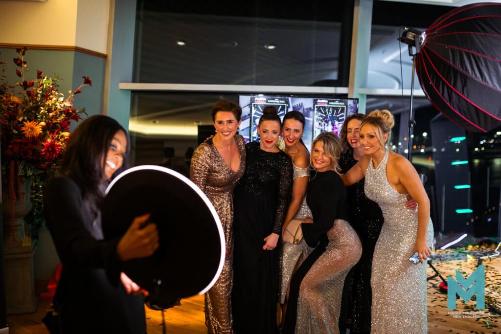 Group of friends posing with the roaming photo booth ring light at a private celebration