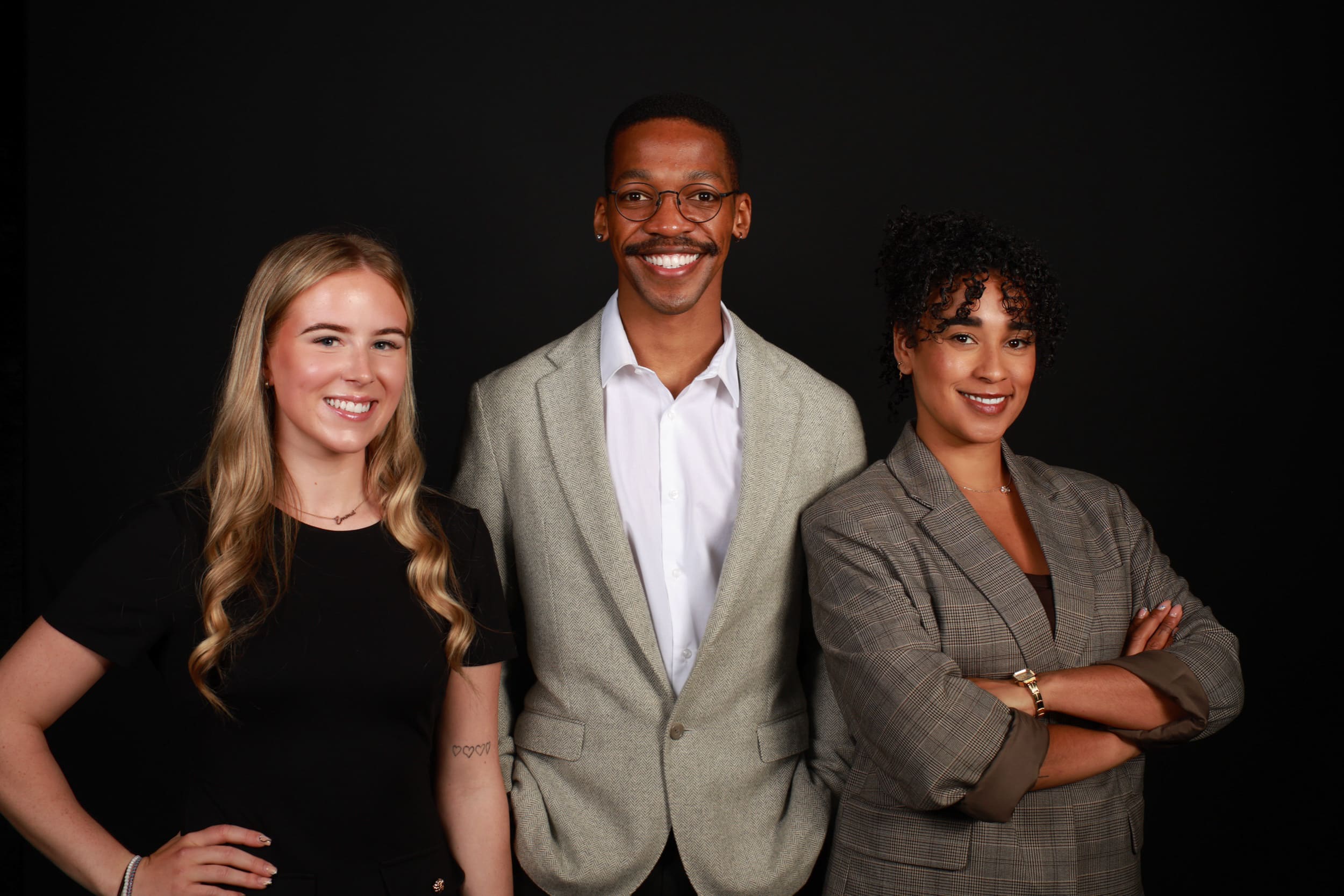 Professional portrait studio session with three smiling guests