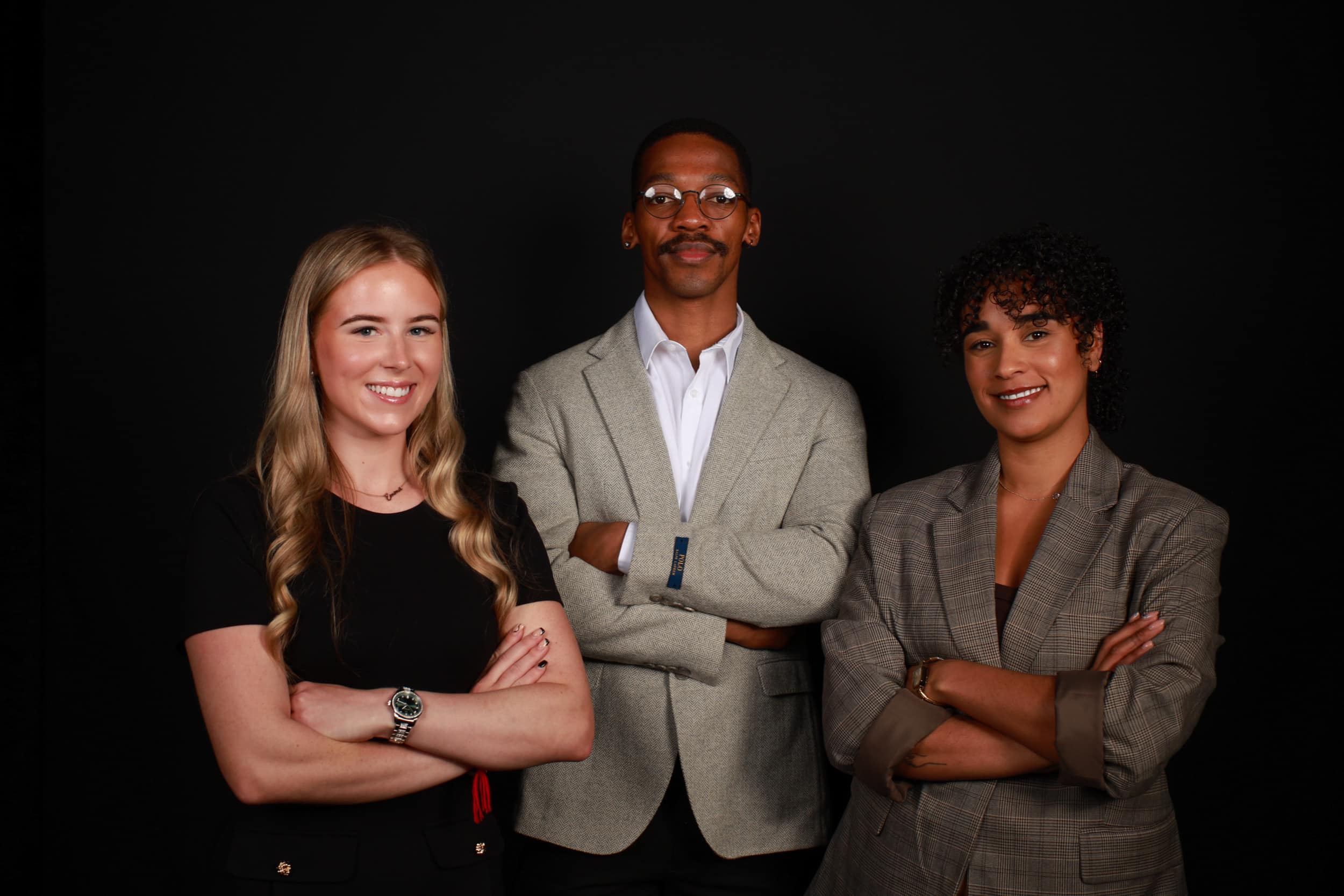 Studio-quality portraits of three people at a corporate event.