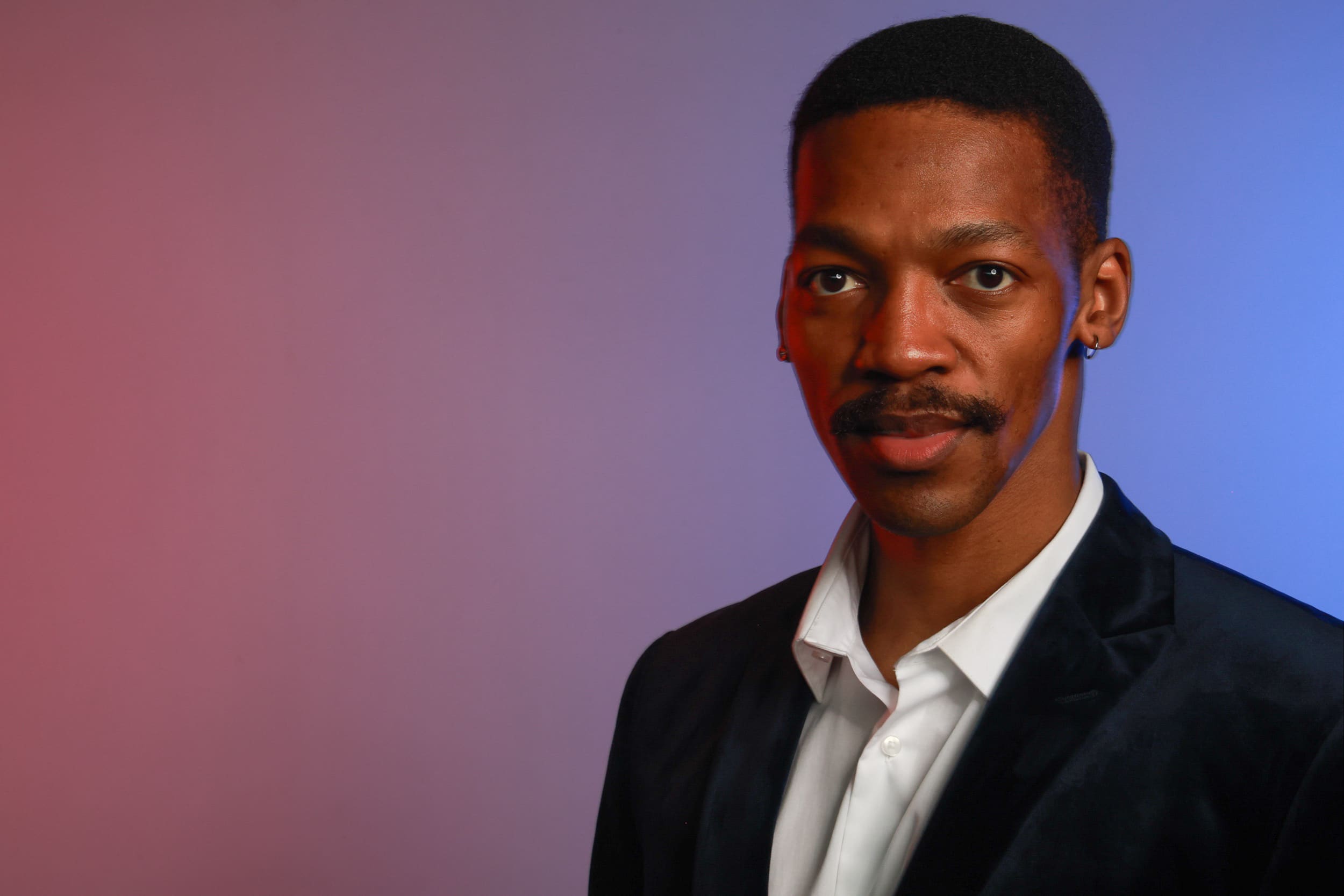 Professional headshot portrait at corporate event with studio lighting