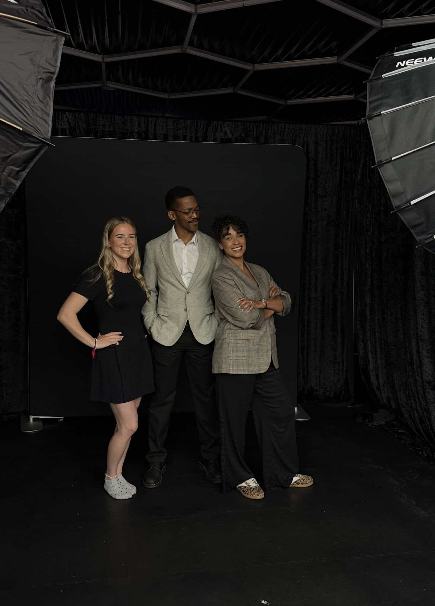 Professional studio portraits at corporate event and wedding with custom backdrop and lighting.