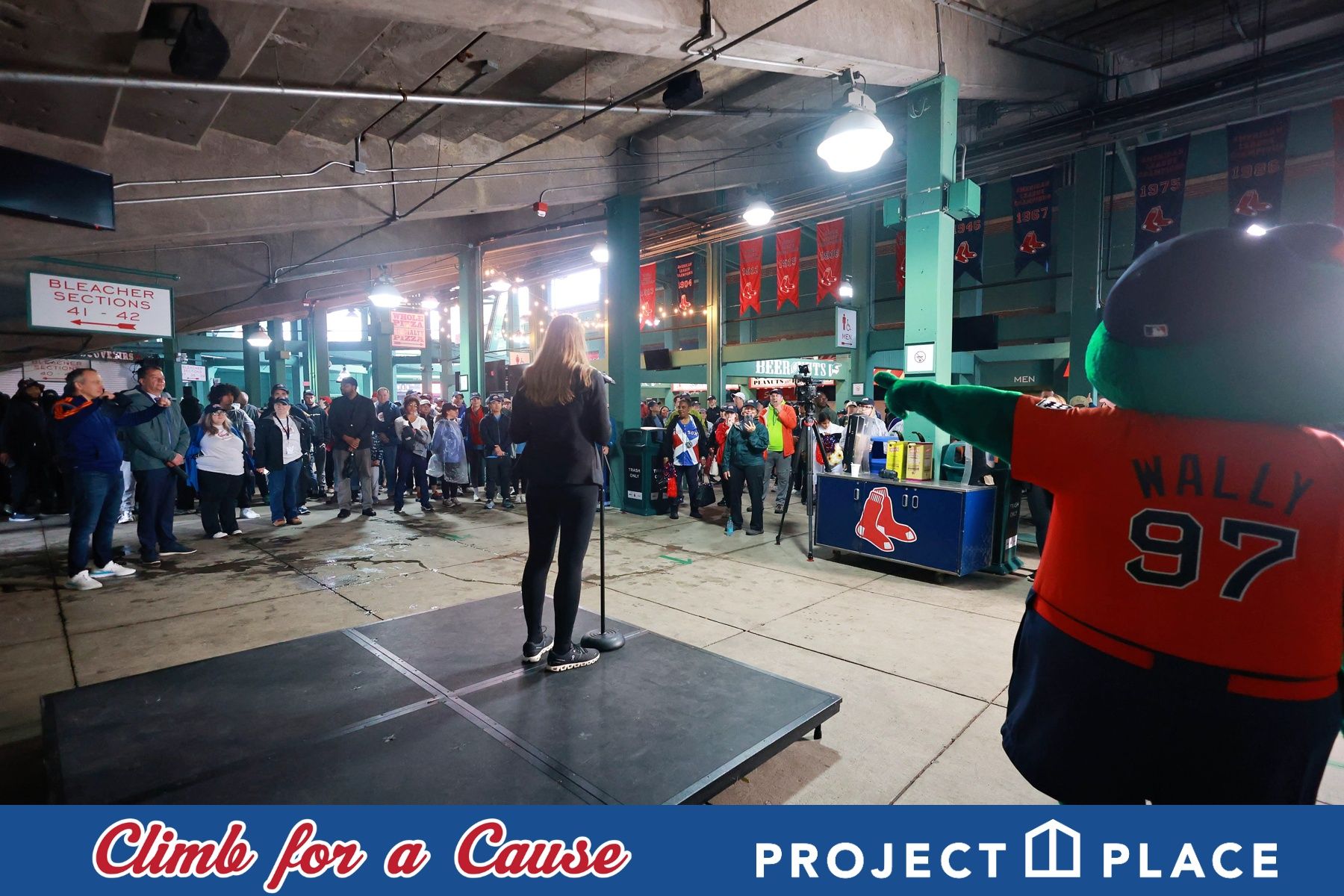Event speaker with Wally the Green Monster at the Climb for a Cause charity event