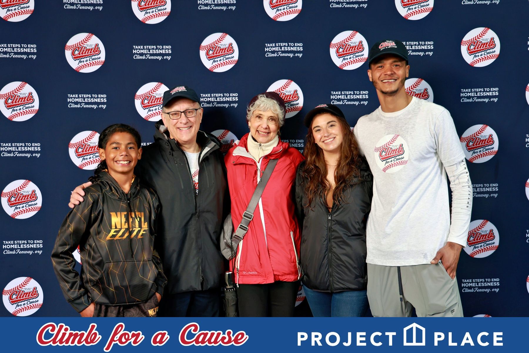 Family group posing with championship trophies at the Climb for a Cause charity event