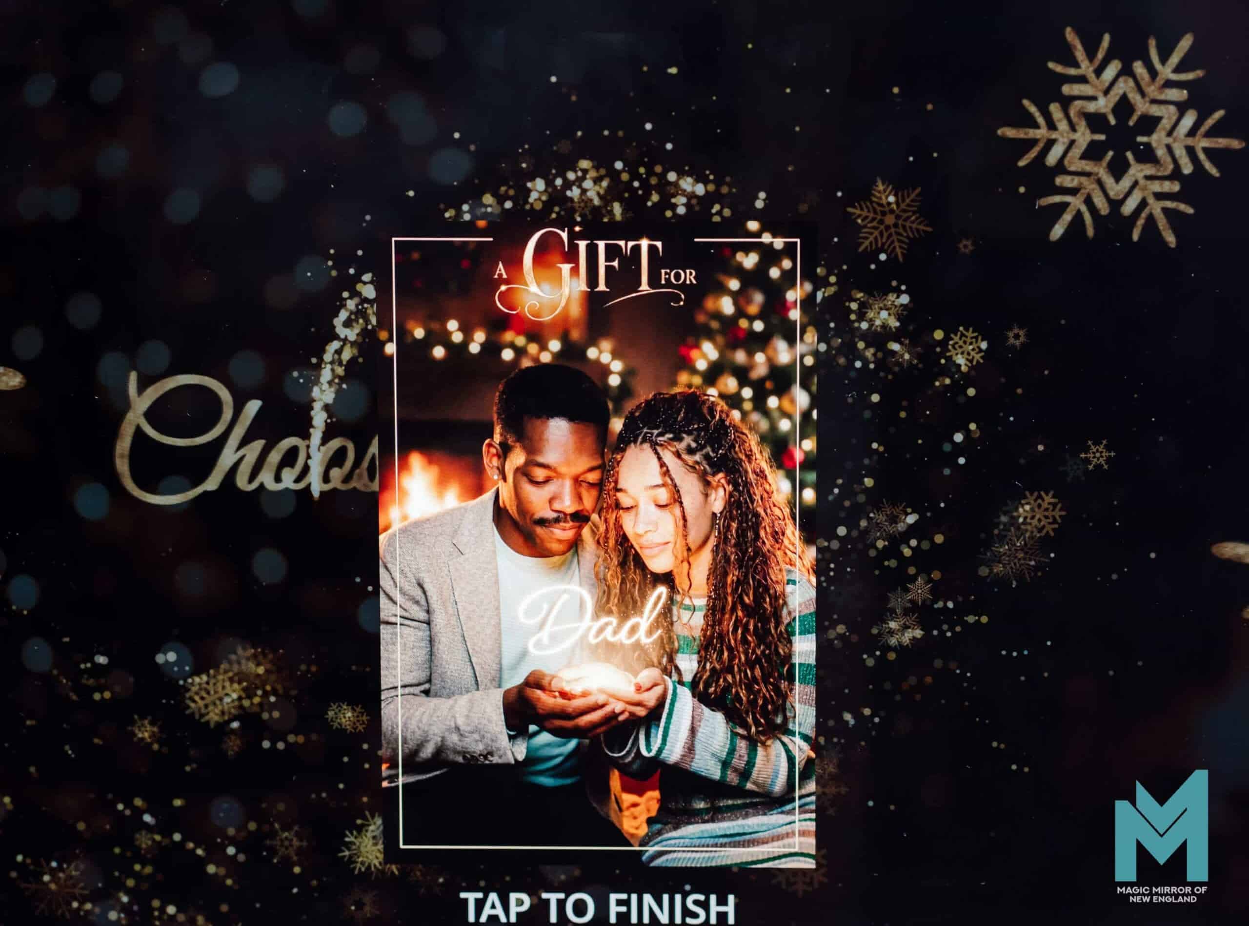 Guest holding their hands out presenting a name as a gift, gold frame overlay, Magic Mirror of New England holiday photo booth in New Hampshire