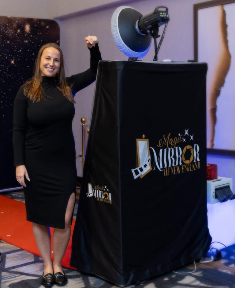Magic Mirror of New England photo booth with studio lighting and a branded black cover at an NH event