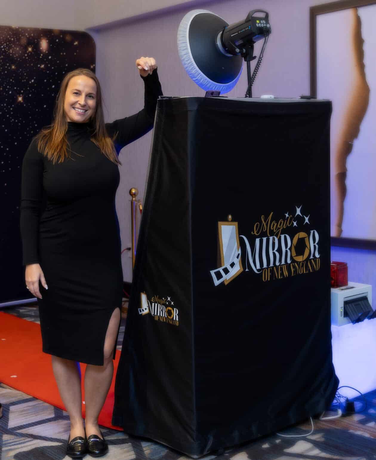 Magic Mirror of New England photo booth with studio lighting and a branded black cover at an NH event