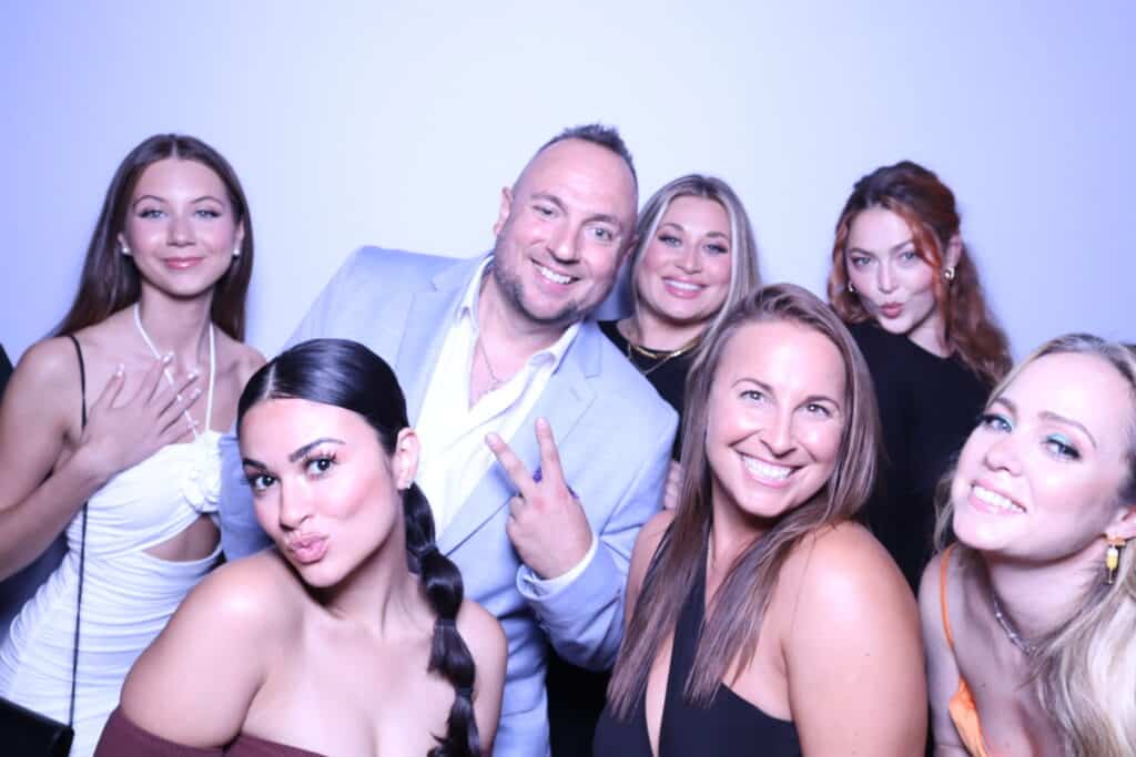 Guests posing at the GLAM Photo Booth at a Bostonman Magazine event in Boston, MA