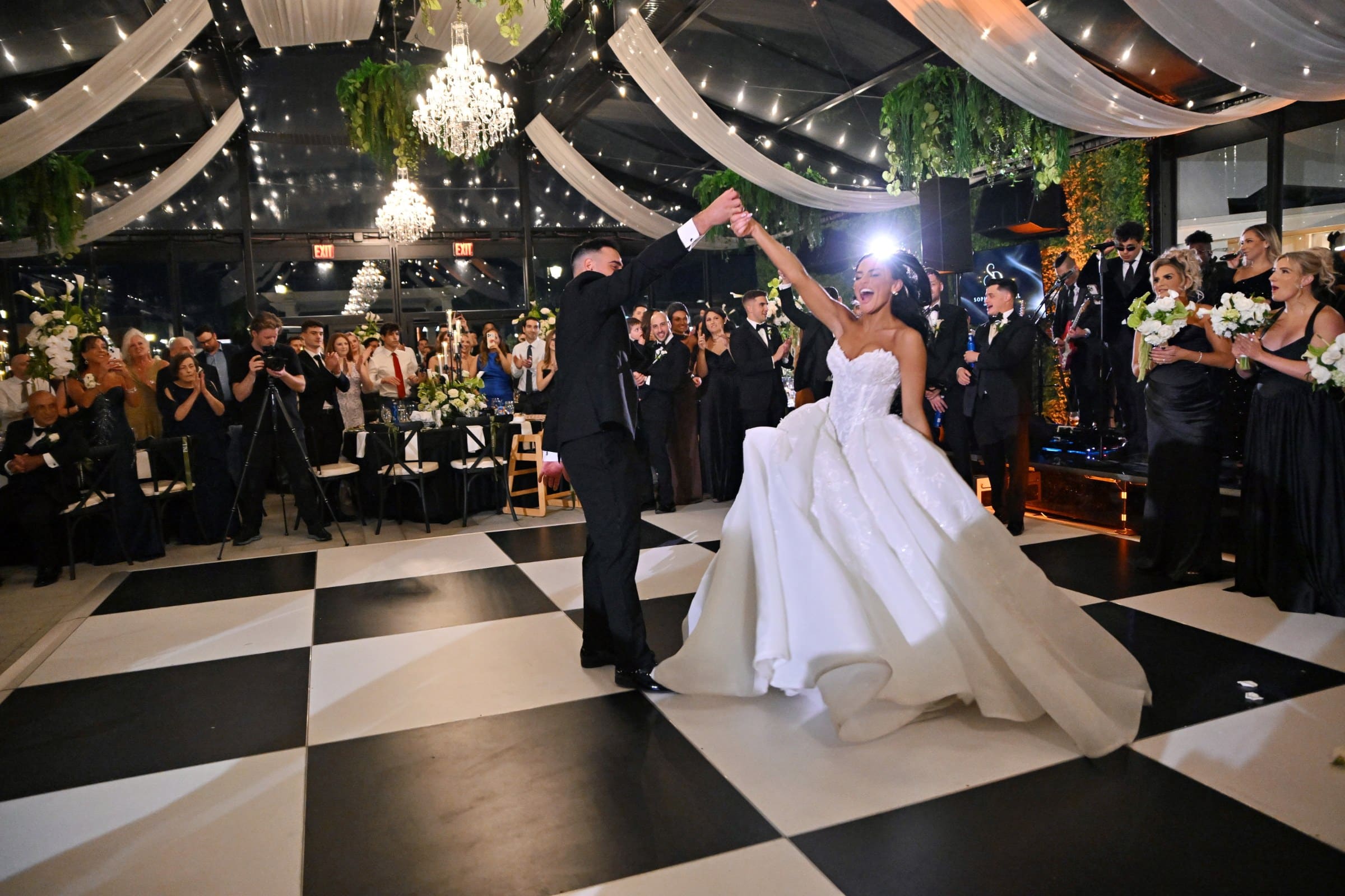 First dance under the chandeliers at The Artisan Hotel at Tuscan Village, Salem NH, event photography by Magic Mirror of New England