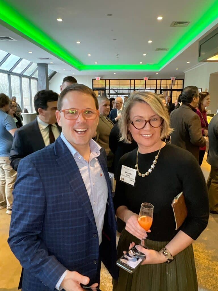 Two guests with cocktails in the roaming photo booth at a Manchester, NH awards event