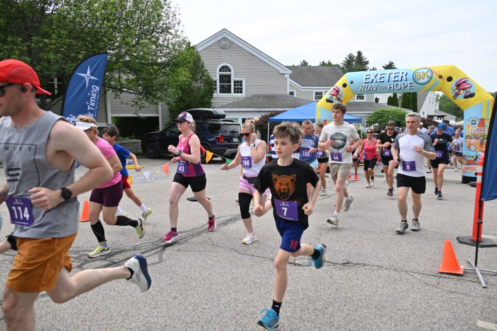 Runners and walkers heading out from the start of the Exeter Run for Hope 5K