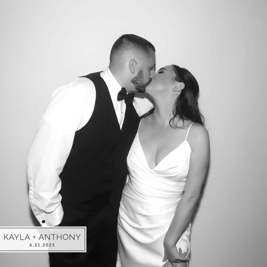 Black and white GLAM GIF poster of a wedding couple with a name and date overlay