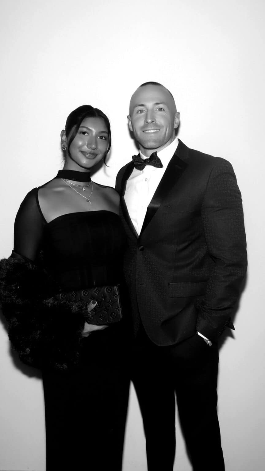 Black and white GLAM booth portrait of a couple in black tie at a New Hampshire gala