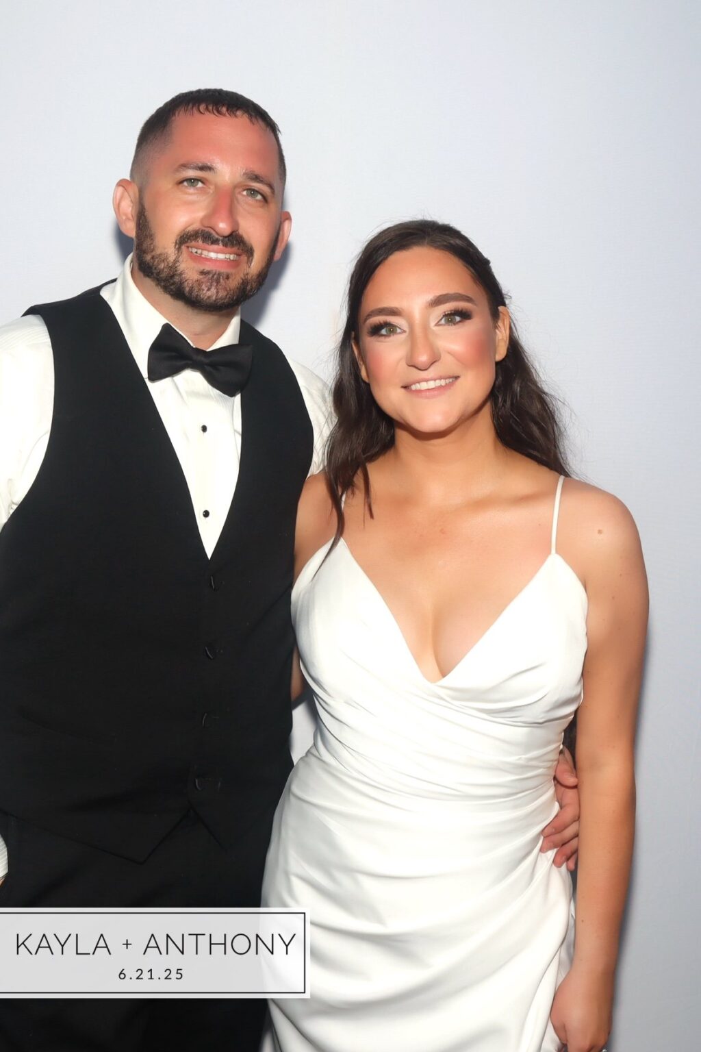 Color GLAM portrait of a wedding couple with a custom name and date overlay in the corner