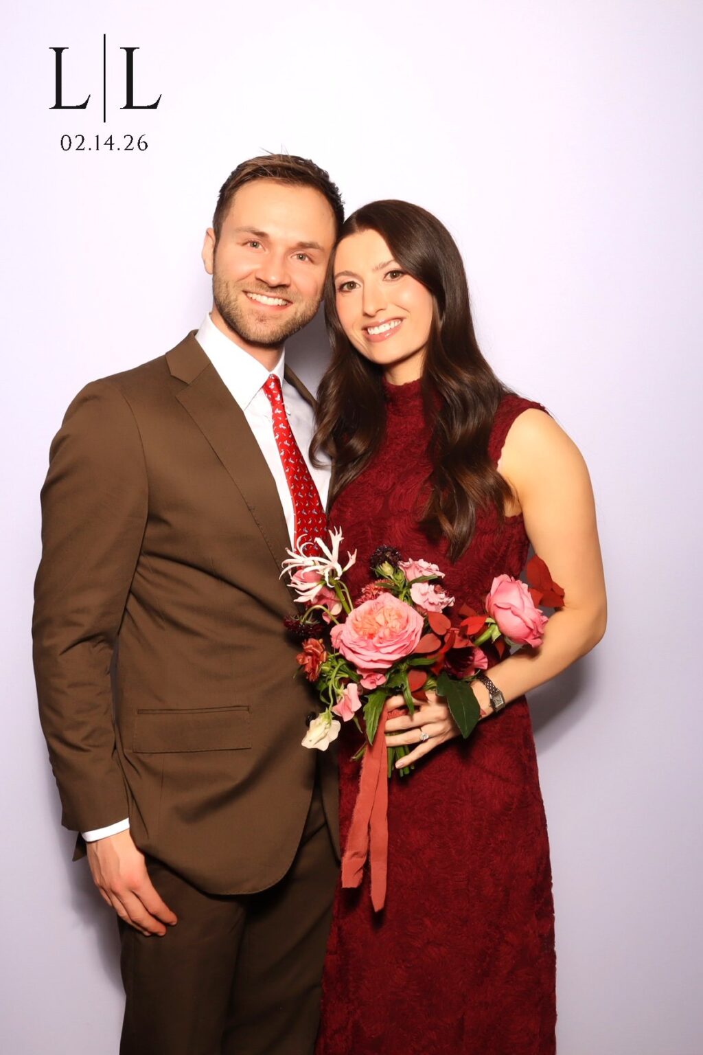 GLAM booth 4x6 print of a smiling couple with a custom monogram and date overlay added to the photo