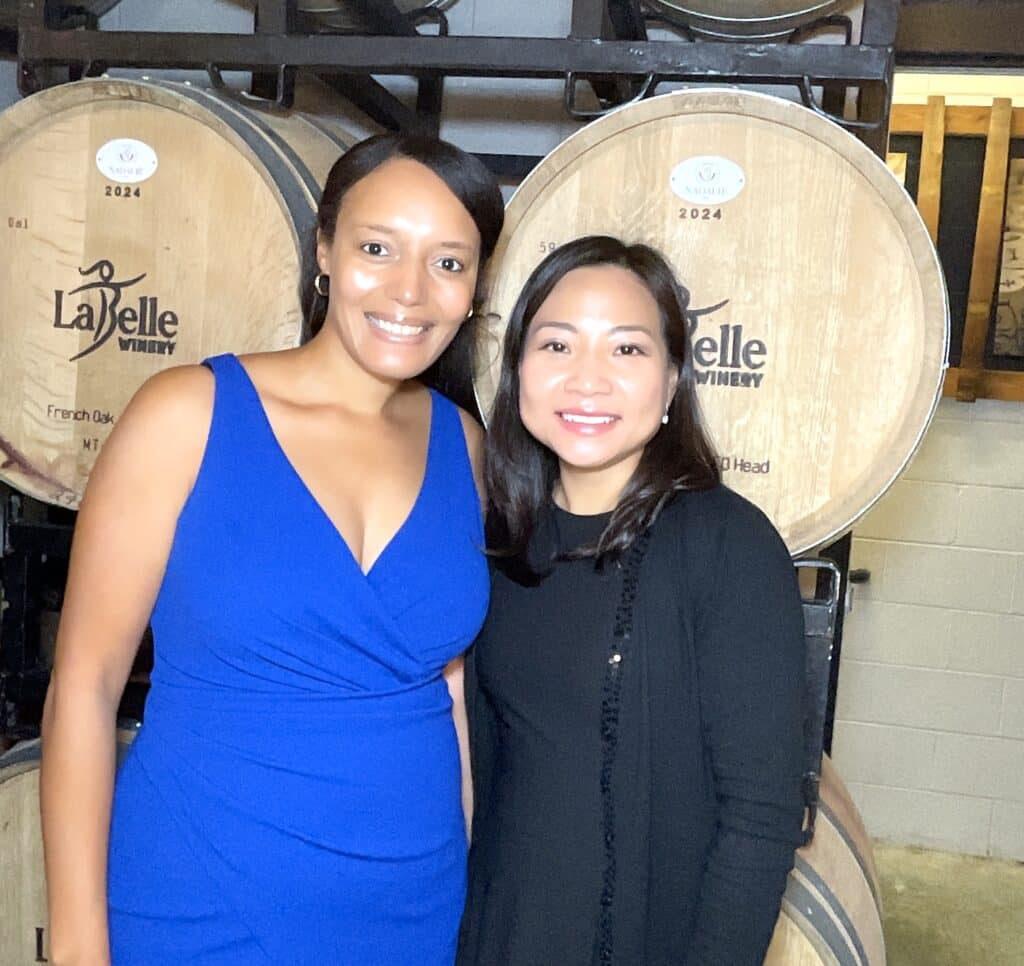 Guests in front of LaBelle wine barrels, roaming photo booth at LaBelle Winery Amherst NH